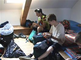 Packing panniers after breakfast in our unusual tower dorm at Mariastein-Rotberg Youth Hostel
